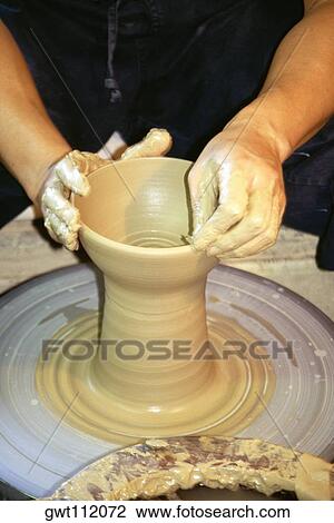Close-up of a person's hands making a vase on a potter wheel, Tokushima, Shikoku, Japan View Large Photo Image Stock Image - Close-up of a person's hands making a vase on a potter wheel, Tokushima, Shikoku, Japan. Fotosearch