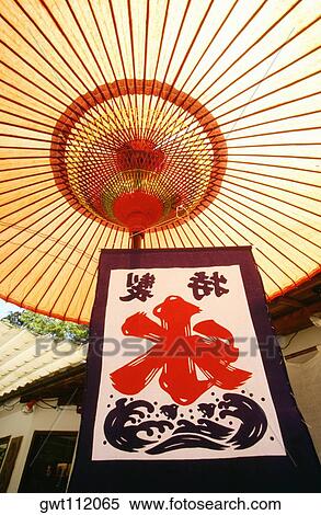 Low angle view of a symbol under a parasol, Nara, Japan View Large Photo Image Stock Photography - Low angle view of a symbol under a parasol, Nara, Japan. Fotosearch
