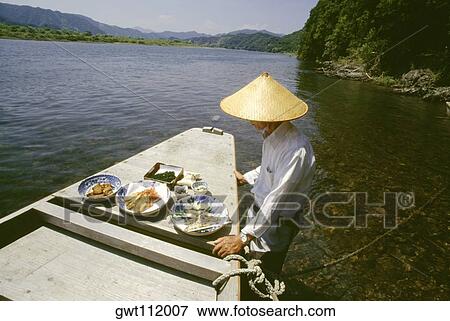 Mature man standing near a boat, Shimanto River, Kochi, Shikoku, Japan View Large Photo Image Stock Photo - Mature man standing near a boat, Shimanto River, Kochi, Shikoku, Japan. Fotosearch