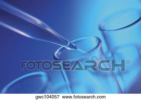 Close-up of a dropper pouring liquid into a test tube View Large Photo Image Stock Photo - Close-up of a dropper pouring liquid into a test tube. Fotosearch