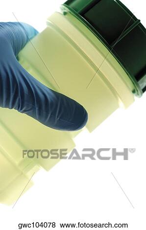 Close-up of a jar in a person's hand View Large Photo Image Stock Photo - Close-up of a jar in a person's hand. Fotosearch