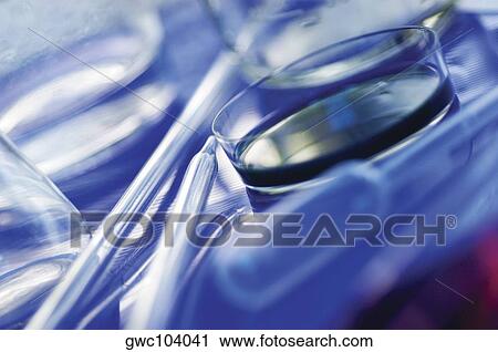 Stock Image - Close-up of droppers and petri dishes. Fotosearch