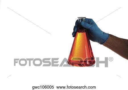 Close-up of a beaker in a person's hand View Large Photo Image Stock Photography - Close-up of a beaker in a person's hand. Fotosearch
