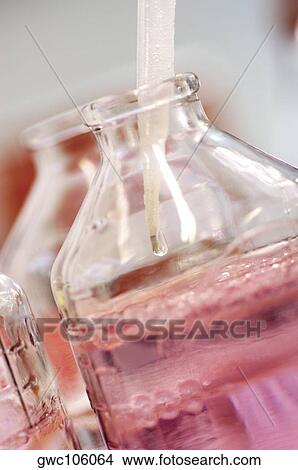 Close-up of a dropper in chemicals in a glass jar View Large Photo Image Picture - Close-up of a dropper in chemicals in a glass jar. Fotosearch