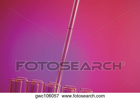 Close-up of a dropper over test tubes View Large Photo Image Stock Photo - Close-up of a dropper over test tubes. Fotosearch