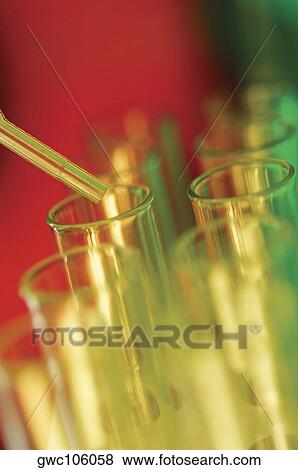Close-up of a dropper over test tubes View Large Photo Image Stock Photo - Close-up of a dropper over test tubes. Fotosearch