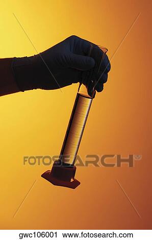 Close-up of a test tube in a person's hand View Large Photo Image Stock Image - Close-up of a test tube in a person's hand. Fotosearch