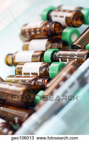 High angle view of glass vials View Large Photo Image Stock Image - High angle view of glass vials. Fotosearch