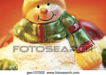 Close-up of a snowman figurine View Large Photo Image Stock Image - Close-up of a snowman figurine. Fotosearch