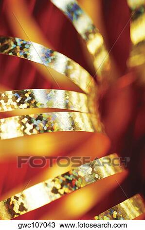 Close-up of golden decorative string View Large Photo Image Stock Image - Close-up of golden decorative string. Fotosearch