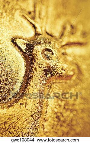 Close-up of a reindeer embossed on a Christmas ball View Large Photo Image Picture - Close-up of a reindeer embossed on a Christmas ball. Fotosearch