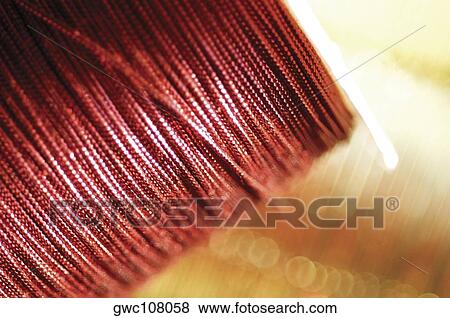 Close-up of a spool of a decorative string View Large Photo Image Stock Photo - Close-up of a spool of a decorative string. Fotosearch