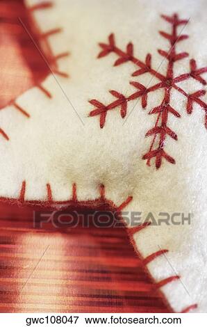 Close-up of embroidery on a star shaped cushion View Large Photo Image Stock Photo - Close-up of embroidery on a star shaped cushion. Fotosearch