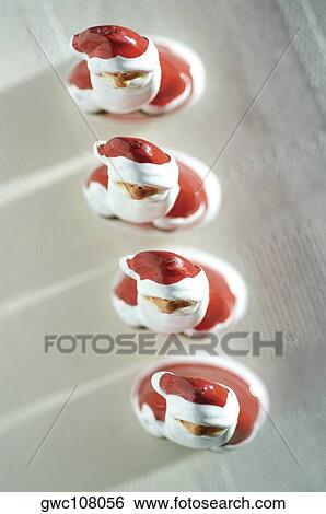 High angle view of a row of Santa Claus figurines View Large Photo Image Stock Photograph - High angle view of a row of Santa Claus figurines. Fotosearch