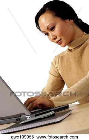 Businesswoman working on a laptop View Large Photo Image Stock Photography - Businesswoman working on a laptop. Fotosearch