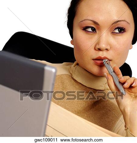 Close-up of a businesswoman holding a pen View Large Photo Image Stock Image - Close-up of a businesswoman holding a pen. Fotosearch