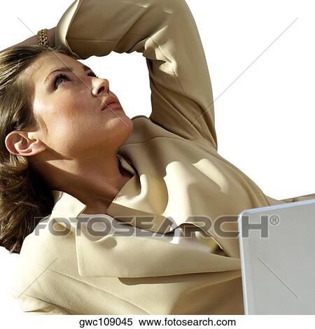 Close-up of a businesswoman in front of a laptop View Large Photo Image Stock Photography - Close-up of a businesswoman in front of a laptop. Fotosearch