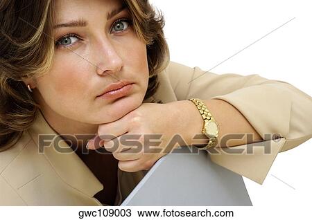 Stock Image - Close-up of a businesswoman looking serious. Fotosearch