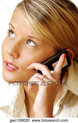 Close-up of a businesswoman talking on a mobile phone View Large Photo Image Stock Image - Close-up of a businesswoman talking on a mobile phone. Fotosearch