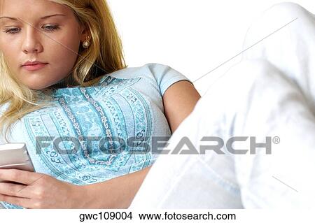 Close-up of a businesswoman using a mobile phone View Large Photo Image Picture - Close-up of a businesswoman using a mobile phone. Fotosearch
