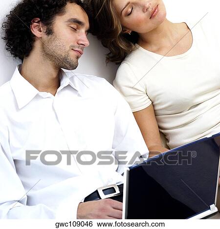 Close-up of a young couple sleeping View Large Photo Image Stock Photograph - Close-up of a young couple sleeping. Fotosearch