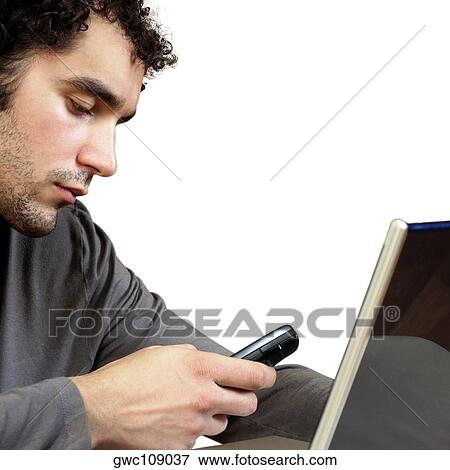 Close-up of a young man using a mobile phone View Large Photo Image Stock Photo - Close-up of a young man using a mobile phone. Fotosearch