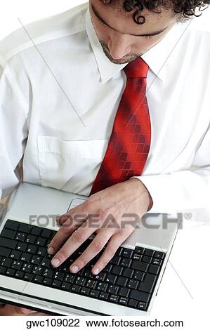 High angle view of a businessman using a laptop View Large Photo Image Stock Image - High angle view of a businessman using a laptop. Fotosearch