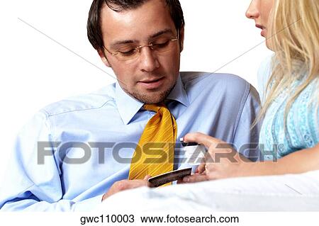 Businessman and a businesswoman looking at credit cards View Large Photo Image Stock Image - Businessman and a businesswoman looking at credit cards. Fotosearch