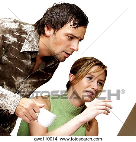 Businessman and a businesswoman discussing View Large Photo Image Picture - Businessman and a businesswoman discussing. Fotosearch
