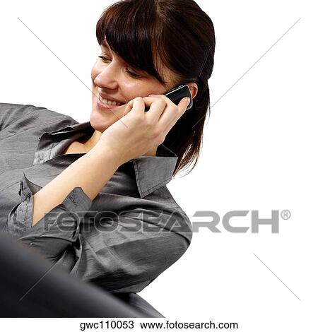 Businesswoman talking on a mobile phone View Large Photo Image Stock Image - Businesswoman talking on a mobile phone. Fotosearch