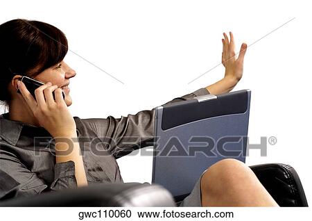 Businesswoman talking on a mobile phone View Large Photo Image Stock Image - Businesswoman talking on a mobile phone. Fotosearch