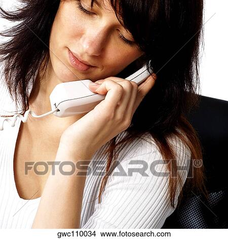 Picture - Close-up of a businesswoman talking on the telephone. Fotosearch