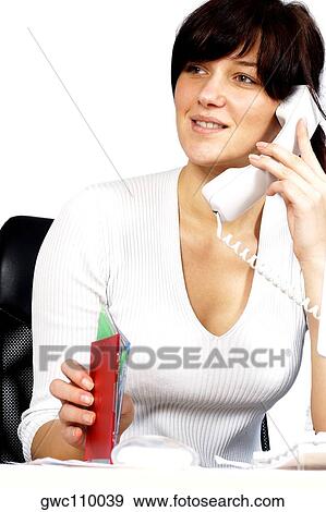 Close-up of a businesswoman talking on the telephone View Large Photo Image Stock Photo - Close-up of a businesswoman talking on the telephone. Fotosearch
