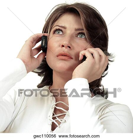 Close-up of a businesswoman using two mobile phones View Large Photo Image Stock Photograph - Close-up of a businesswoman using two mobile phones. Fotosearch