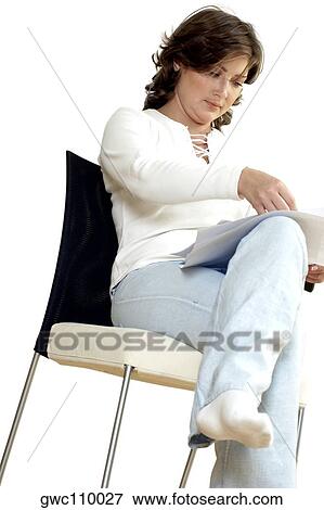 Low angle view of a businesswoman holding documents View Large Photo Image Stock Photo - Low angle view of a businesswoman holding documents. Fotosearch