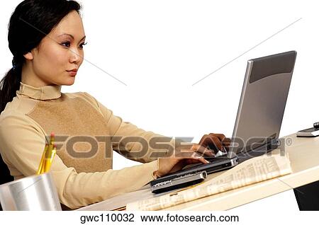 Side profile of a businesswoman using a laptop View Large Photo Image Stock Image - Side profile of a businesswoman using a laptop. Fotosearch