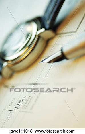 Close-up of a fountain pen and a wristwatch on a bank deposit slip View Large Photo Image Stock Photo - Close-up of a fountain pen and a wristwatch on a bank deposit slip. Fotosearch