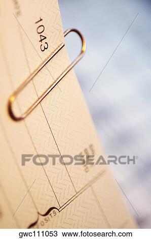 Close-up of a paper clip on a bank deposit slip View Large Photo Image Stock Image - Close-up of a paper clip on a bank deposit slip. Fotosearch