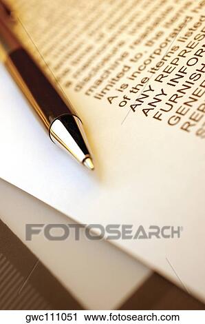Close-up of a pen on a document View Large Photo Image Stock Image - Close-up of a pen on a document. Fotosearch