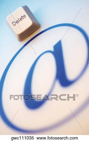 Stock Photography - Close-up of an 'at' symbol with a computer key. Fotosearch