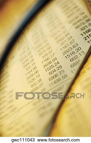 Close-up of financial figures on paper seen through a magnifying glass View Large Photo Image Stock Image - Close-up of financial figures on paper seen through a magnifying glass. Fotosearch