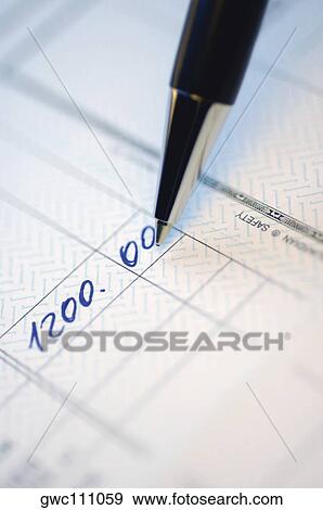 Close-up of numbers written on a bank deposit slip View Large Photo Image Stock Photo - Close-up of numbers written on a bank deposit slip. Fotosearch