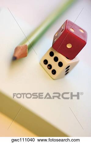 Close-up of two dices with a pencil View Large Photo Image Stock Image - Close-up of two dices with a pencil. Fotosearch