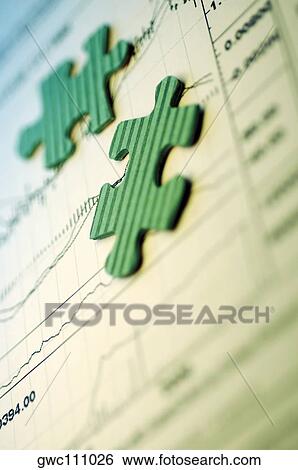 Jigsaw pieces on a stock market report View Large Photo Image Stock Photograph - Jigsaw pieces on a stock market report. Fotosearch