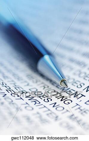 Stock Photo - Close-up of a ballpoint pen on paper. Fotosearch