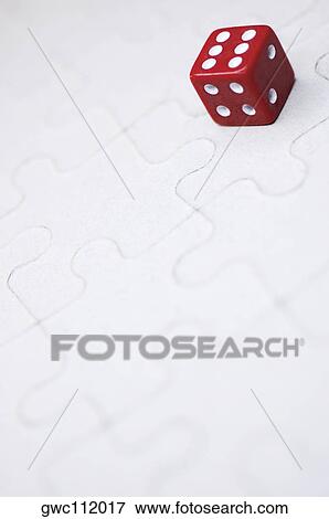 Close-up of a dice on a jigsaw puzzle View Large Photo Image Stock Photo - Close-up of a dice on a jigsaw puzzle. Fotosearch