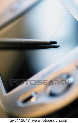 Close-up of a palmtop and a stylus View Large Photo Image Stock Photo - Close-up of a palmtop and a stylus. Fotosearch