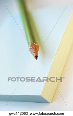 Close-up of a pencil on a notepad View Large Photo Image Stock Image - Close-up of a pencil on a notepad. Fotosearch