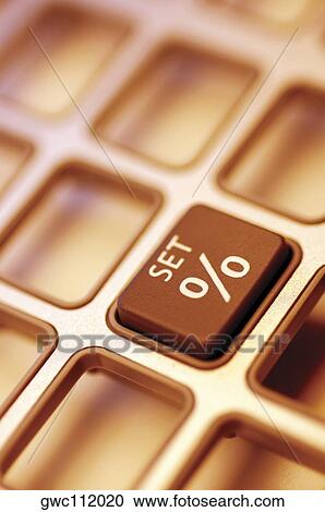 Stock Image - Close-up of a percentage button on a calculator. Fotosearch
