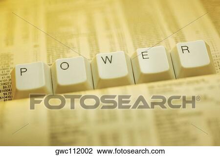 Stock Image - Close-up of computer keys on a newspaper. Fotosearch